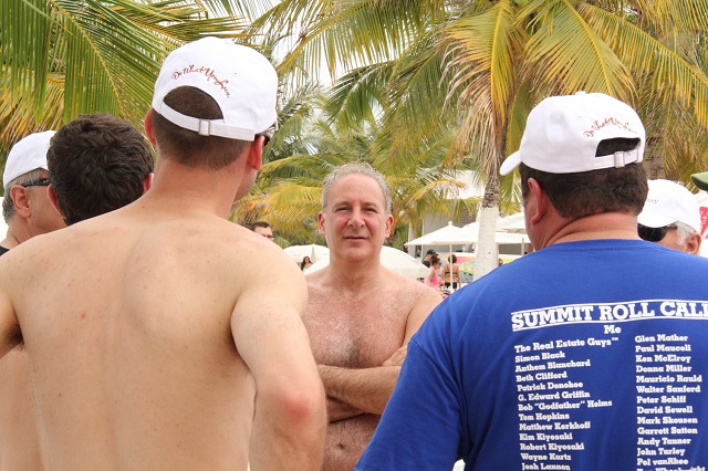 Peter Schiff talks with investors at the Investor Summit at Sea beach party