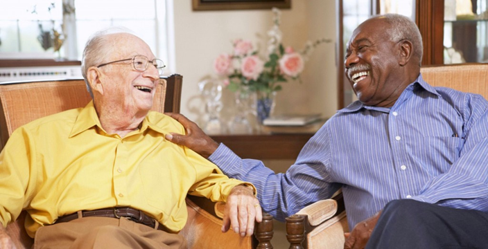 Two men enjoy fellowship in an assisted living home